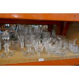 A large selection of crystal glasses, bowls, decanters, etc