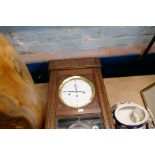 A selection of clocks, wall and mantle and a large wooden vase and a resin whippet