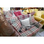 Two modern Next sofas, having Tartan style upholstery, with matching footstool