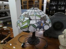 A Tiffany style table lamp decorated butterflies