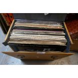 A box of vinyl LPs from the 1970s and 1980s, including The Beatles, The Nitty Gritty Dirt Band, etc