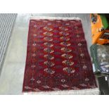 Four Modern Bokhara rugs having elephant pad design, the largest 174cm x 129cms