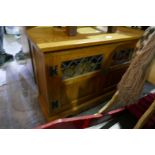 An Old Charm Oak corner cabinet having two doors