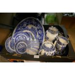 A box of blue and white Willow pattern china including teapot, mugs, bowls, etc