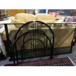 A modern black painted single bedstead by Dico
