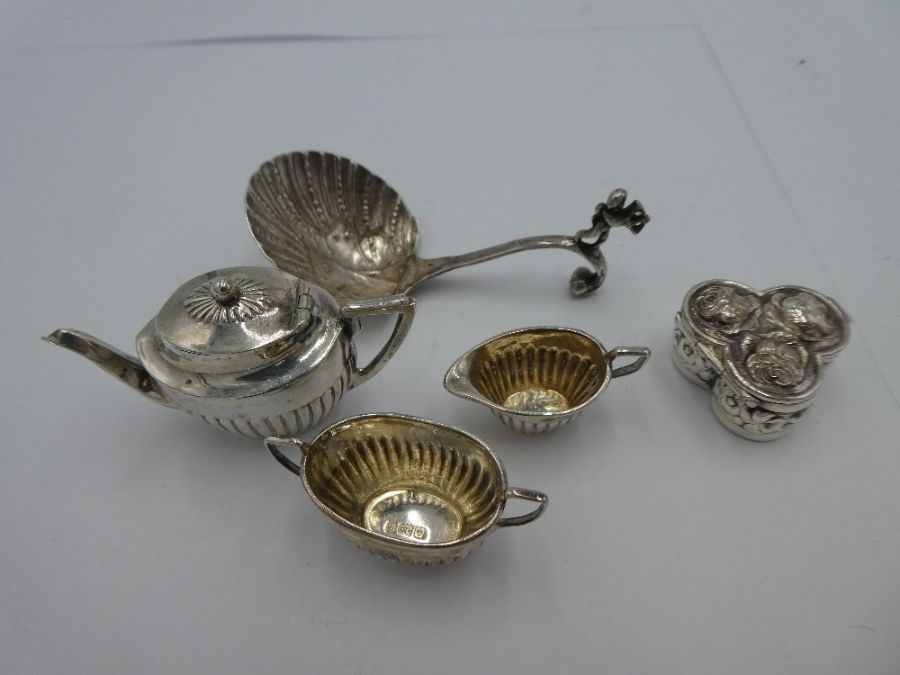 A silver miniature tea service by Cornelius Desormeaux Saunders and James Francis Hollings Shepherd.