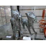 A pair of 20th century African metal figures of dogs/cats
