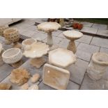 Four modern bird baths and a single top