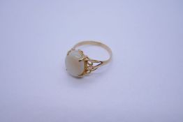14K yellow gold ring with large Opal in four claw mount on Split floral shoulders, marked 58514, siz