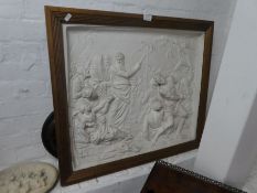 A plaster plaque depicting ancient Greek figures with snakes, 67.5 x 58cm, and one other smalle