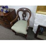 A Victorian mahogany open armchair with pierced splat on cabriole legs