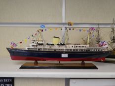 A wooden model of The Royal Yacht Britannia and one other of HMS Victory (Britannia 73cm)
