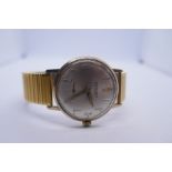 Vintage gent's 'Excalibur' gold cased wristwatch on expanding strap; silvered dial and golden number