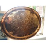 A Keswick School of Arts oval copper tray decorated flowers, 60cm