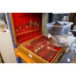 A boxed canteen of cutlery and some collector's plates