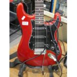 A Squier electric guitar by Fender and Fender Frontman 15G Amp