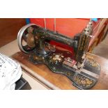 The Essex Miniature Sewing machine and antique hand cranked sewing machine with all over floral deco
