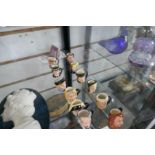 A set of twelve Royal Doulton hand painted miniature Dickens Character jugs