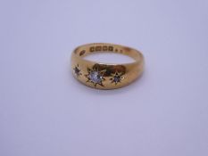 18ct yellow gold three stone gypsy ring, with 3 starburst set diamonds the largest approx 0.10 carat