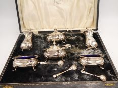 A cased set of silver Adie Brothers Ltd Salts in an Ollivant and Botsford, Manchester case. With fou
