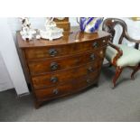 A Georgian mahogany bow fronted chest having four long drawers on splay feet, 97 cms