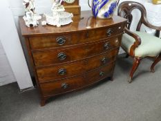 A Georgian mahogany bow fronted chest having four long drawers on splay feet, 97 cms