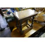 An oak joint stool made from timber from H.M.S. Britannia (Cadet Training Ship)