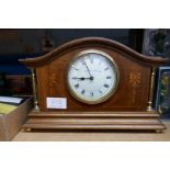 An Edwardian mahogany mantel clock by Walker and Hall