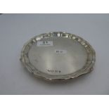 A silver Viners Ltd tray of circular form standing on three acanthus leaves scroll feet. Hallmarked