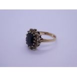 9ct yellow gold cluster ring with large flack faceted stone surrounded clear examples, size M, appro