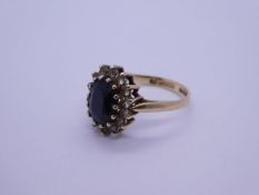 9ct yellow gold cluster ring with large flack faceted stone surrounded clear examples, size M, appro