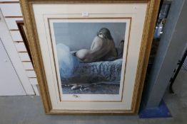 A pencil signed limited edition print of a nude laying on a bed, 58 / 295