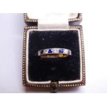 Pretty yellow gold and possibly Platinum band ring, set with alternating sapphires and diamonds comp