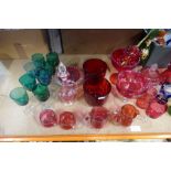 A large selection of Cranberry glass, etc including jugs, cups, vases, etc