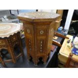 A Syrian Moorish octagonal side table having inlaid decoration, height 56cm