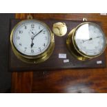 A ship's barometer and clock set on mahogany plaque by Kelvin Hughes