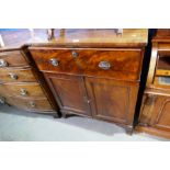 An antique mahogany secretaire having cupboard below on splay legs