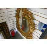 A 19th Century carved giltwood mirror, decorated leaves and flowers, height 116cm