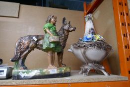 A chalk figure of a young girl and shepherd dog, plus a china urn