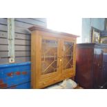 A modern pine dresser with glazed back