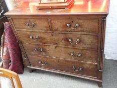 An antique mahogany chest having two short and three long drawers, with cluster column corners, 118