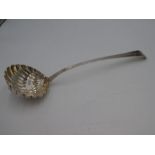 A very large silver George III Georgian ladle, having a shell moulded bowl and decorative engraved h
