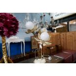 A vintage table lamp decorated flowers and a modern lamp having feather shade