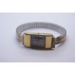 Antique 18ct yellow gold cased ladies watch, with rectangular face and silvered dial, case marked 18