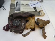 A World War II leather flying helmet with speech module belonging to SUB. LT. GEOFF DUNWORTH, Observ