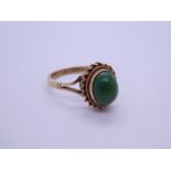 9ct yellow gold dress ring with oval cabouchon green hardstone with twisted frame, marked 375, L & W