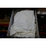 Two boxes of various vintage linen including lace tablecloths, doileys, etc