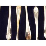 A set of twelve cased silver Thomas Bradbury and Sons Ltd teaspoons having Tulip handle tips, Sheffi