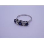 White metal, possibly 18ct white gold Sapphire and diamond 5 stone ring, 3 round cut sapphires and 2