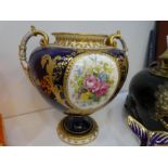 A Royal Crown Derby two-handled urn having all over gilt decoration and two floral panels and a Crow